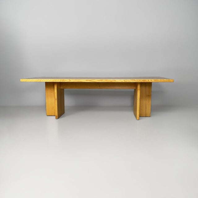 Italian console table in wood, 1970s Honey-colored solid wood console table with a thick rectangular top. The legs consist...