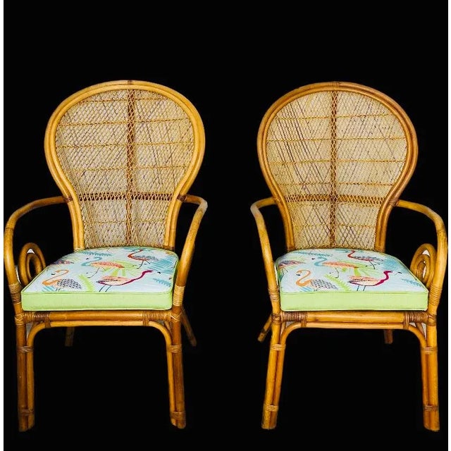 Set of 2 Arm Peacock or fan back dining chairs. The chairs feature a balloon shaped back with a open lattice fretwork...