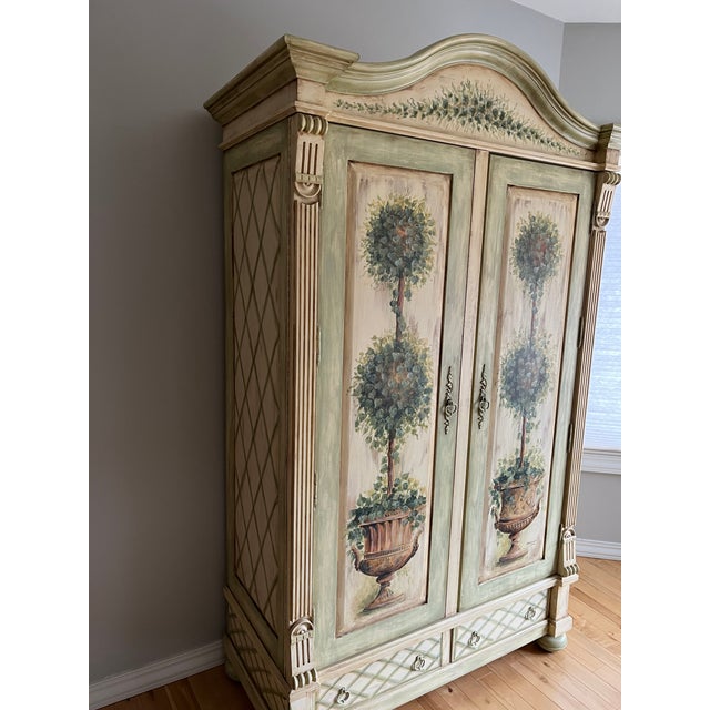 Magnificent, heirloom-quality double door statement armoire from the highly coveted "Topiary" collection by Habersham...