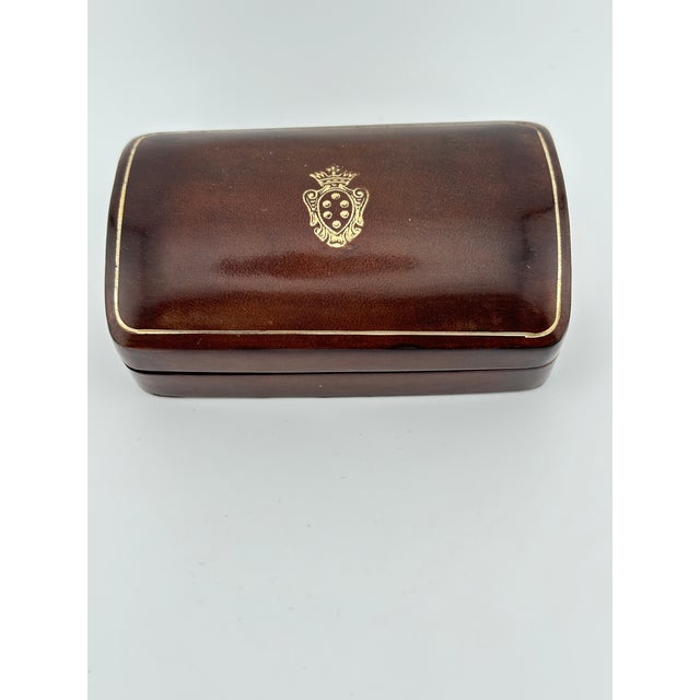 Vintage Italian leather trinket box featuring gold embossing and made by G. Papini, Florence, Italy. This is a pre-owned...