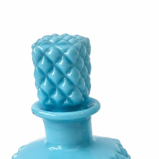 Glass and Crystal - Bottle and box with lid. Made of colored and embossed glass in shades of blue; box with metal rim....