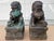 A pair of antique guardian lions or foo dogs in cast bronze. They have aged beautifully, accruing a rich patina with some...
