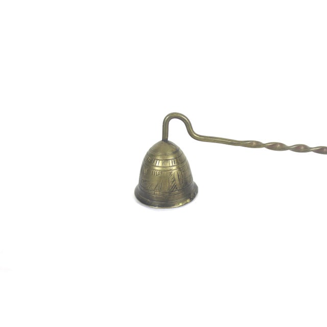 Vintage etched brass candle snuffer with a long twisted handle. This has lots of patina, scratches, soot and wax from use...