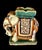 The elephant pictured features ornate decorative harness details and sit on a rectangular base, serving as both a...