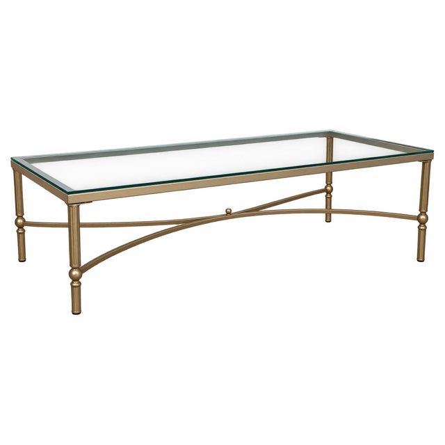 Howard Elliott Rectangular Coffee Table with Antique gold metal finish and smooth glass top. Currently listed new for...
