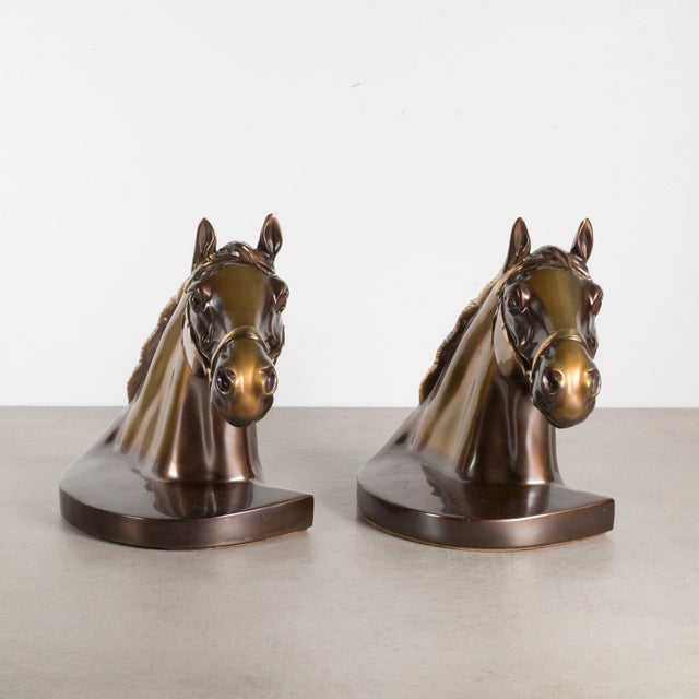 ABOUT A vintage pair of brass plated horse bookends with original felt and original PMC stickers. CREATOR Philadelphia...