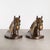 ABOUT A vintage pair of brass plated horse bookends with original felt and original PMC stickers. CREATOR Philadelphia...