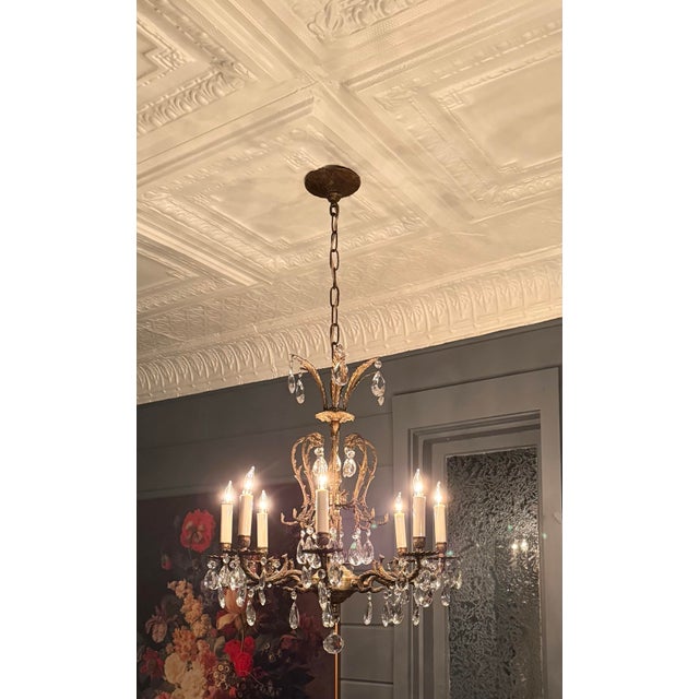 Beautiful Spanish Brass Chandelier with Eight Lights. Includes new insulators and covers. 21” wide x 24” High. Chain links...