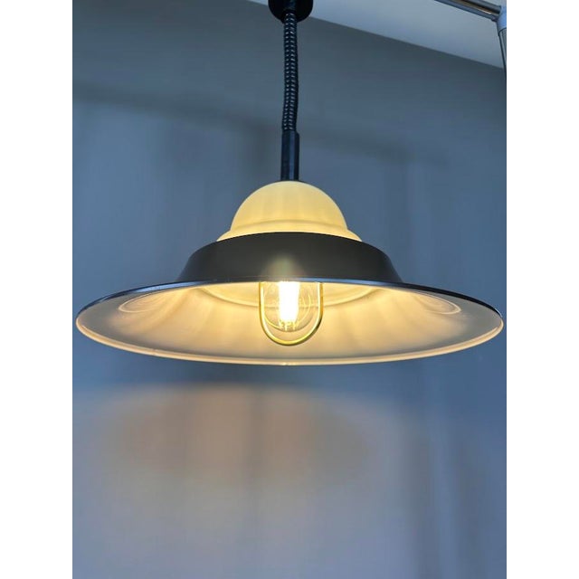 Original Cosack Leuchten pendant lamp, made in Germany in the 1960s. Its distinctive silhouette, striking combination of...