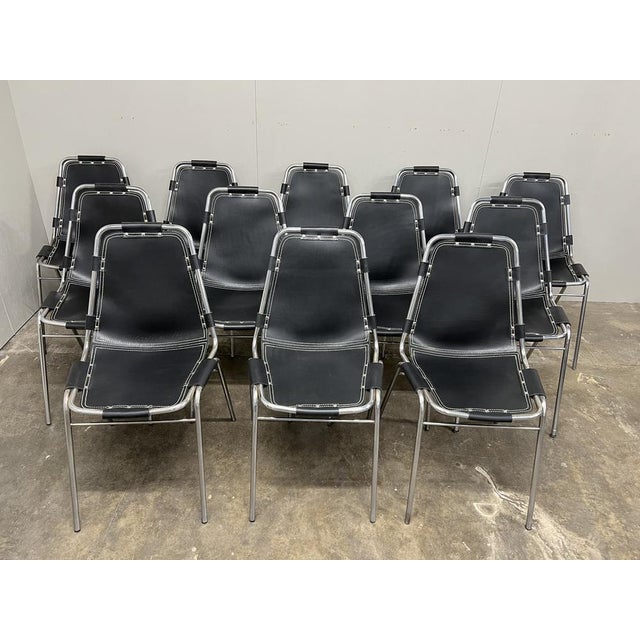 Stunning set of chairs, you will not find another set of 12 black leather chairs like this one on any web site worldwide!...