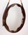 Wall mirror with cord for hanging it on the wall, round frame in shaped walnut wood, Italian design.