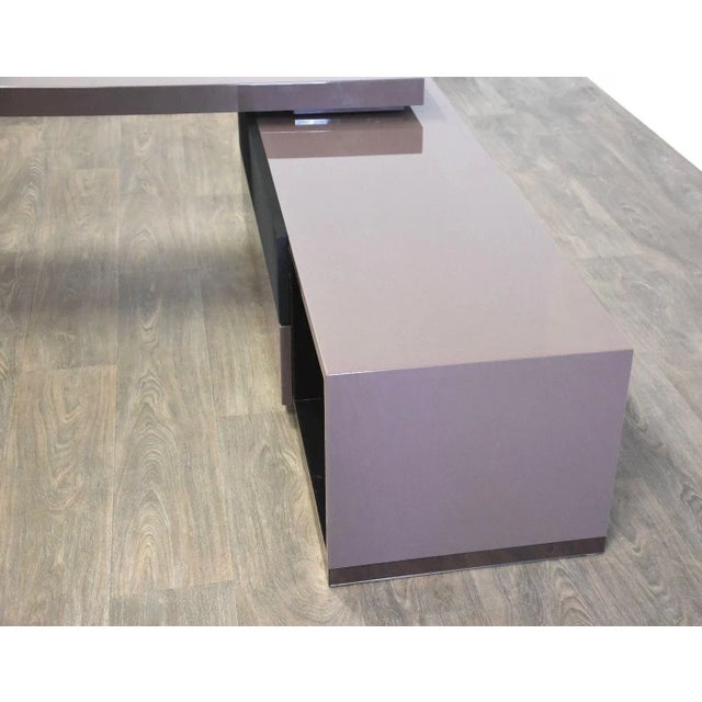 A modern purple swiveling tv stand cabinet credenza by Roche Bobois with bronze mirror PMMA. Lower cabinet measures: 59”...