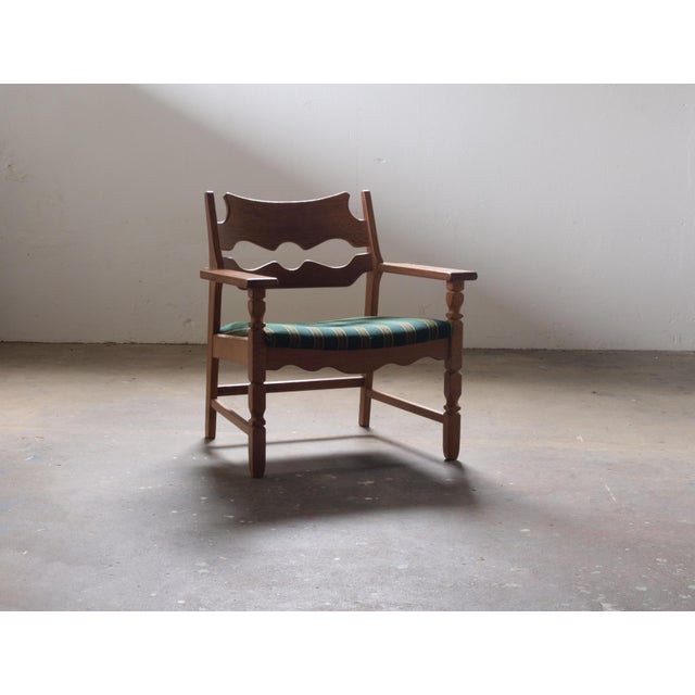 Henning Kjærnulf's lounge chair, known as the "Razorblade," epitomizes Danish Modern design from the 1960s. Crafted from...