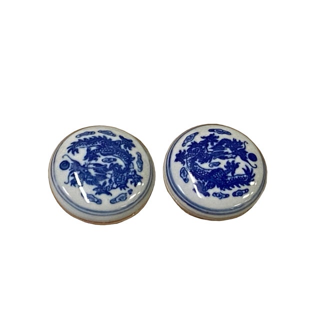 This set features two vintage Chinese blue and white porcelain cinnabar seal paste boxes, each housed in its own silk-...