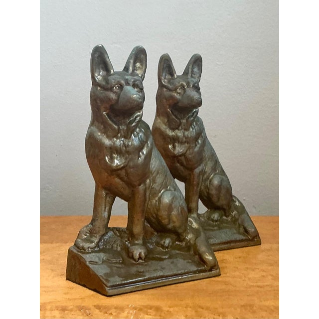 This distinguished pair of vintage bronze dog bookends captures the charm and solidity of mid-20th-century decorative...