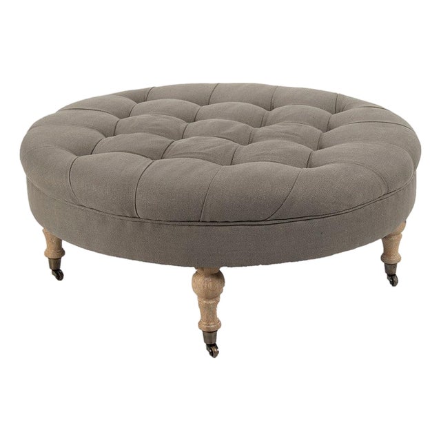 Maison Round Tufted Ottoman in Charcoal with Natural Oak Turned Legs For Sale