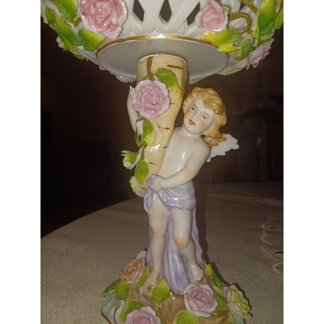 Beautiful antique Bros. Voigt & Alfred Voigt, Sitzendorf reticulated figural compote depicting a scantily clad cherub...