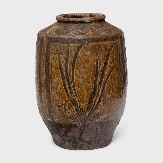 A beautiful example of Chinese folk pottery, this terracotta jar is a 19th-century pickling pot once used for fermenting...