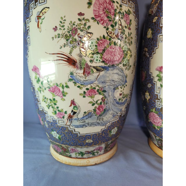 PAIR of Chinese Guangcai porcelain sleeve vases decorated with ornate floral and peacocks scenes in palettes of pink,...