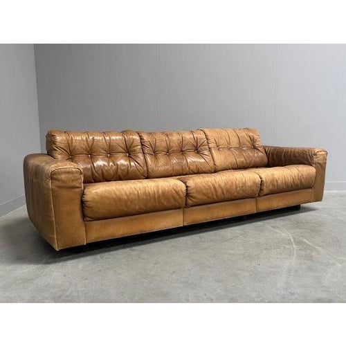 Remarks: Mid century lounge sofa by De Sede. Design by Robert Haussmann, Switzerland 1970s. Wooden frame with cognac...