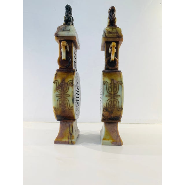 Incredible pair of Early Twentieth Century Chinese soapstone urns with Foo Dog lid finials. Likely used to burn incense....