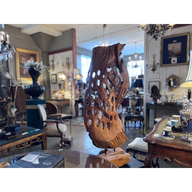 Large Teak Root natural wood sculpture on teak base with iron supports. Height: 42.75” x 17” width x 10.5” depth....