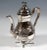 Festive silver coffee or teapot: pear-shaped, bulbous raised body, narrowing again towards the opening, standing on four...