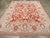 An antique Turkish Oushak room size carpet. Cloud bands are everywhere on the Turkey red ground of this western Anatolian...