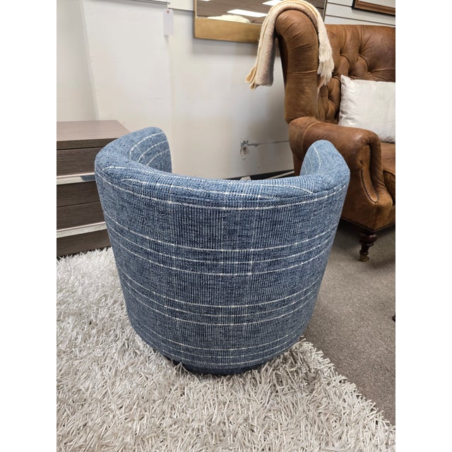 Coastal blue swivel chair by CR Laine.