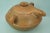 A rare vase, a two-handled container with a lid, entirely hand-molded in terracotta. It is likely an oil container, dating...