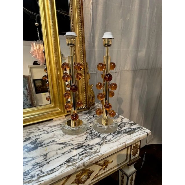 Decorative Peach colored ball form lamps on a brass and lucite base. Creates a designer look! So pretty!