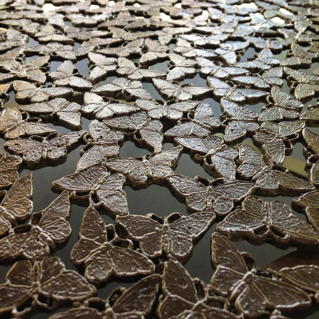 A round swarm of butterflies as delicate as lace in white bronze, lost wax cast by master craftsmen in Italy. A wall...