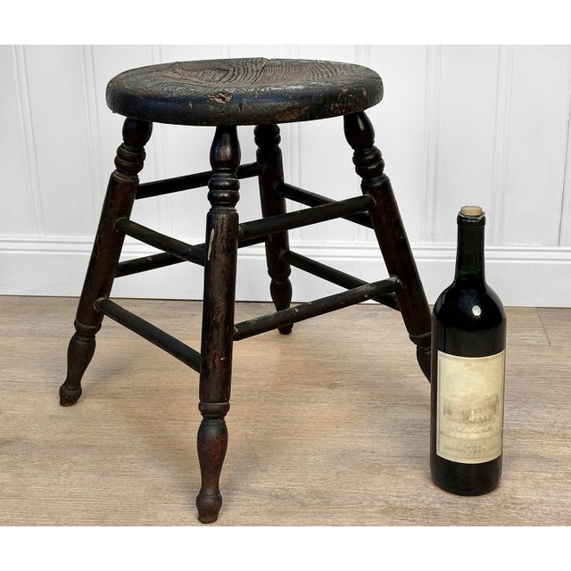 An Primitive Farmhouse Black Wood Milking Stool, c. Early 20th Century - Solid Wood with Early Construction - 17" Tall -...
