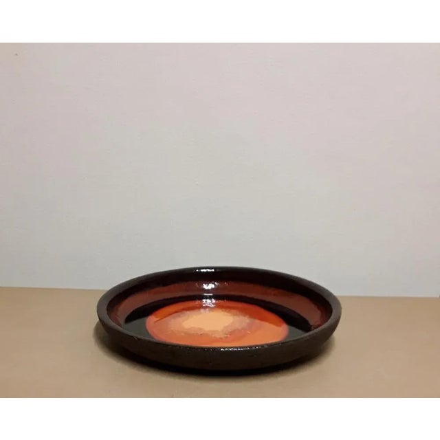 Vintage Finnish Brown Ceramic with Orange Glaze Wall Plate from Stromit, 1970s, in Very Good conditions. Designed 1970 to...