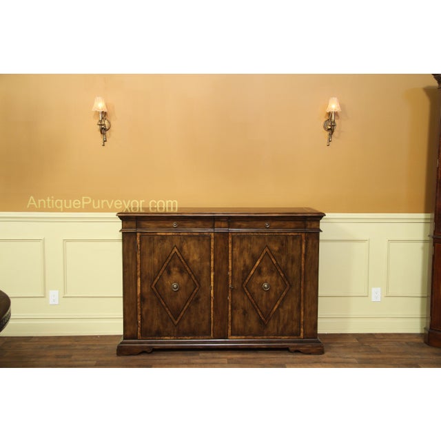 Solid walnut dining room sideboard with Burly inlay. Large-scale sideboard well-suited for a high-end home. The design...