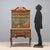Chinoiserie-style mahogany cabinet, partially lacquered and painted. Carved cornice, front with eight drawers and a drop-...