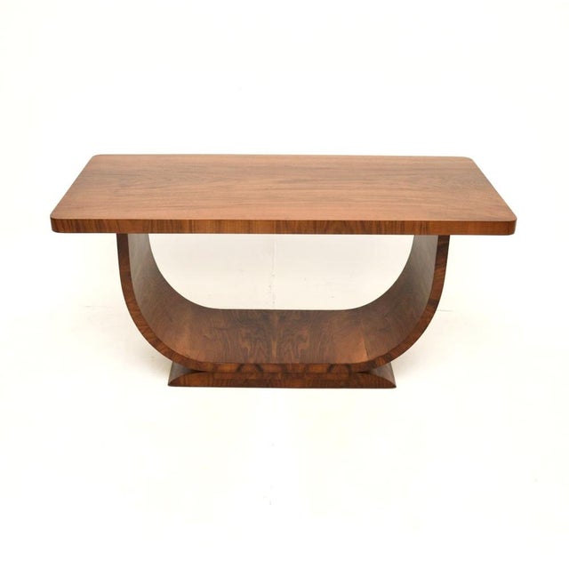 A large and extremely well made Art Deco walnut coffee table. This was made in England, it dates from the 1930’s. It is of...
