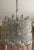 Gorgeous 1960s Mid-century hand-made bubble glass Tulipan Murano chandelier by Kalmar. Sure to make a statement in any...