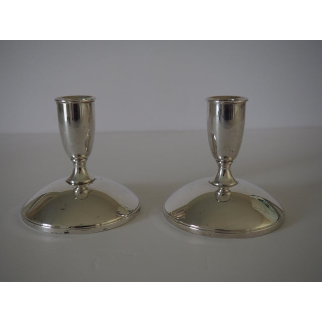 A pair of vintage minimalist, mid-century modern silver candlestick holders Serial #975. Part of the Modern Collection...