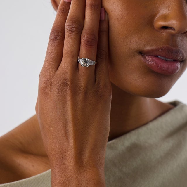 This extraordinary Art Deco engagement ring is a beautifully refined jewel from the 1930’s, centered by a GIA-certified...