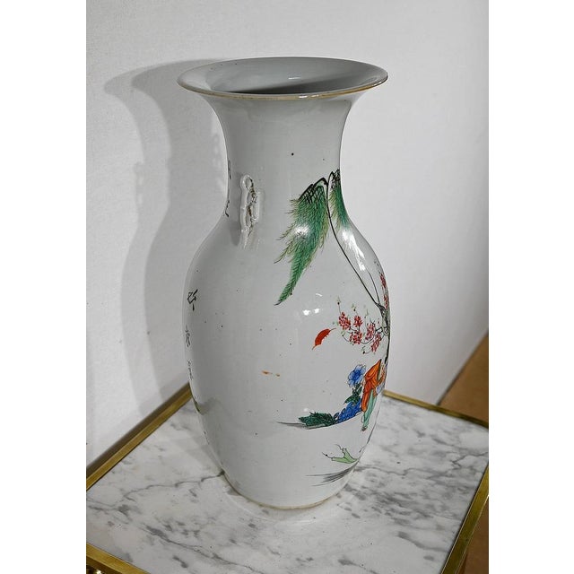 Balustrous form vase, China origin, with polychrome decorations on an ivory background. The main scene represents...