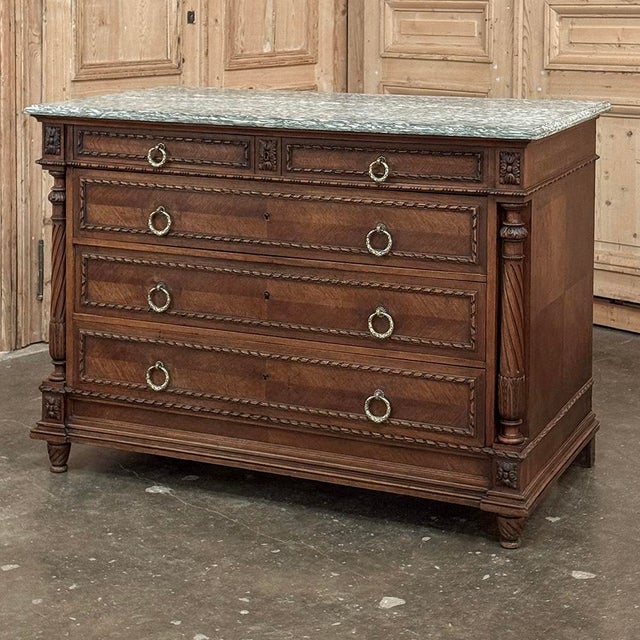 19th Century French Louis XVI Walnut Marble Top Commode is an exceptional example of the furniture craftsman's art! Hand-...