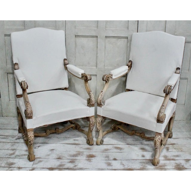 An impressive pair of spanish oak carver chairs with gothic tracery detailing, made from oak, these impressive chairs have...