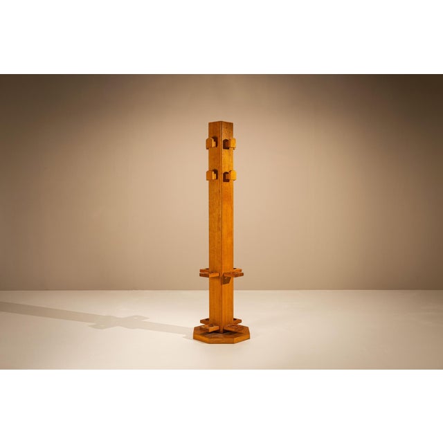 A functional object elevated through craftsmanship. This solid oak coat rack by Giuseppe Rivadossi reflects the designer's...