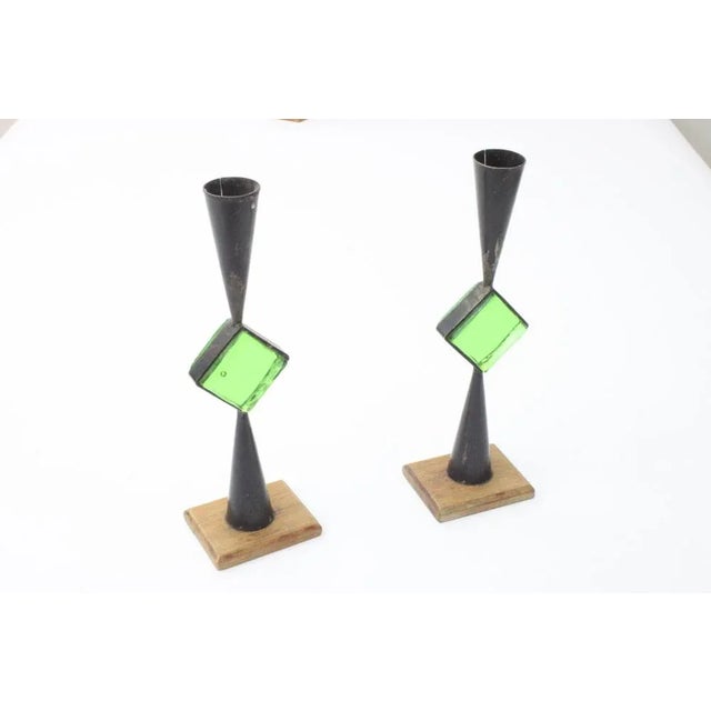 A set of swedish modernist wrought iron candle holders with colored glass by erik hoglund & pierre forsell for bo svensk,...