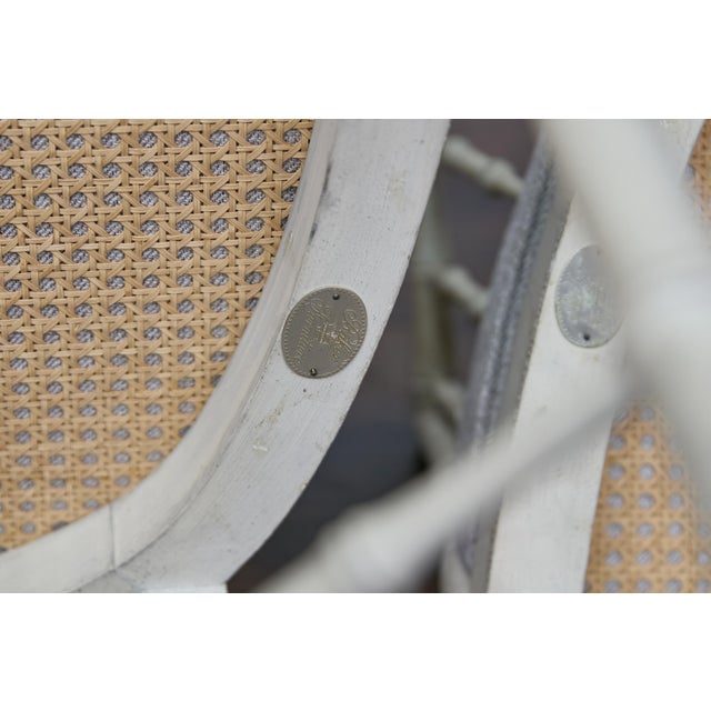 This pair of Baker Furniture faux bamboo chairs embodies the elegance and refinement associated with Baker’s...