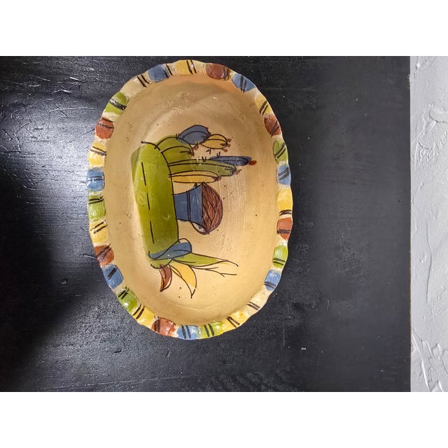 A charming vintage Mexican Tonalá style hand-painted ceramic oval bowl. Features a beautiful central motif of cactus,...
