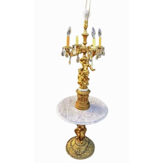 Rare Vintage Hollywood Regency Figural Cherub Candelabra Floor Lamp With Integrated Marble Table Available Now at Vintage Royale Usa. For Sale