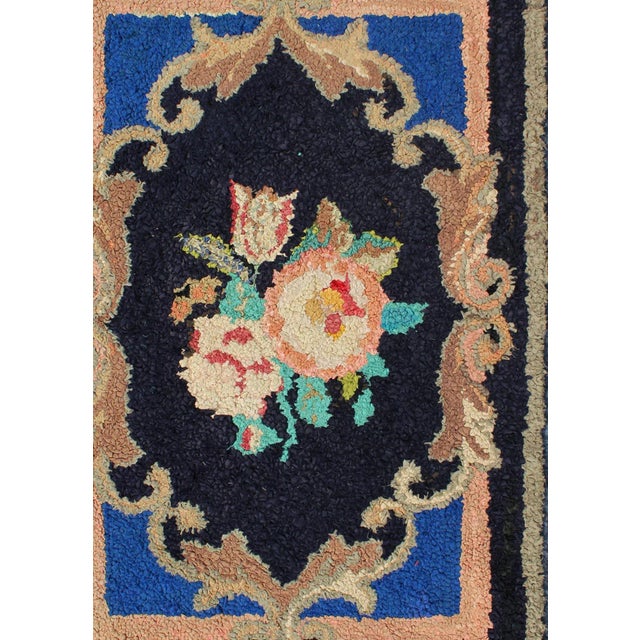 This beautiful antique American Hook rug sets on black background with large floral medallion. Antique American hooked rug...