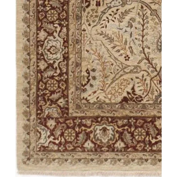 Artistry and heritage are intertwined to re create this eye catching Agra style rug.